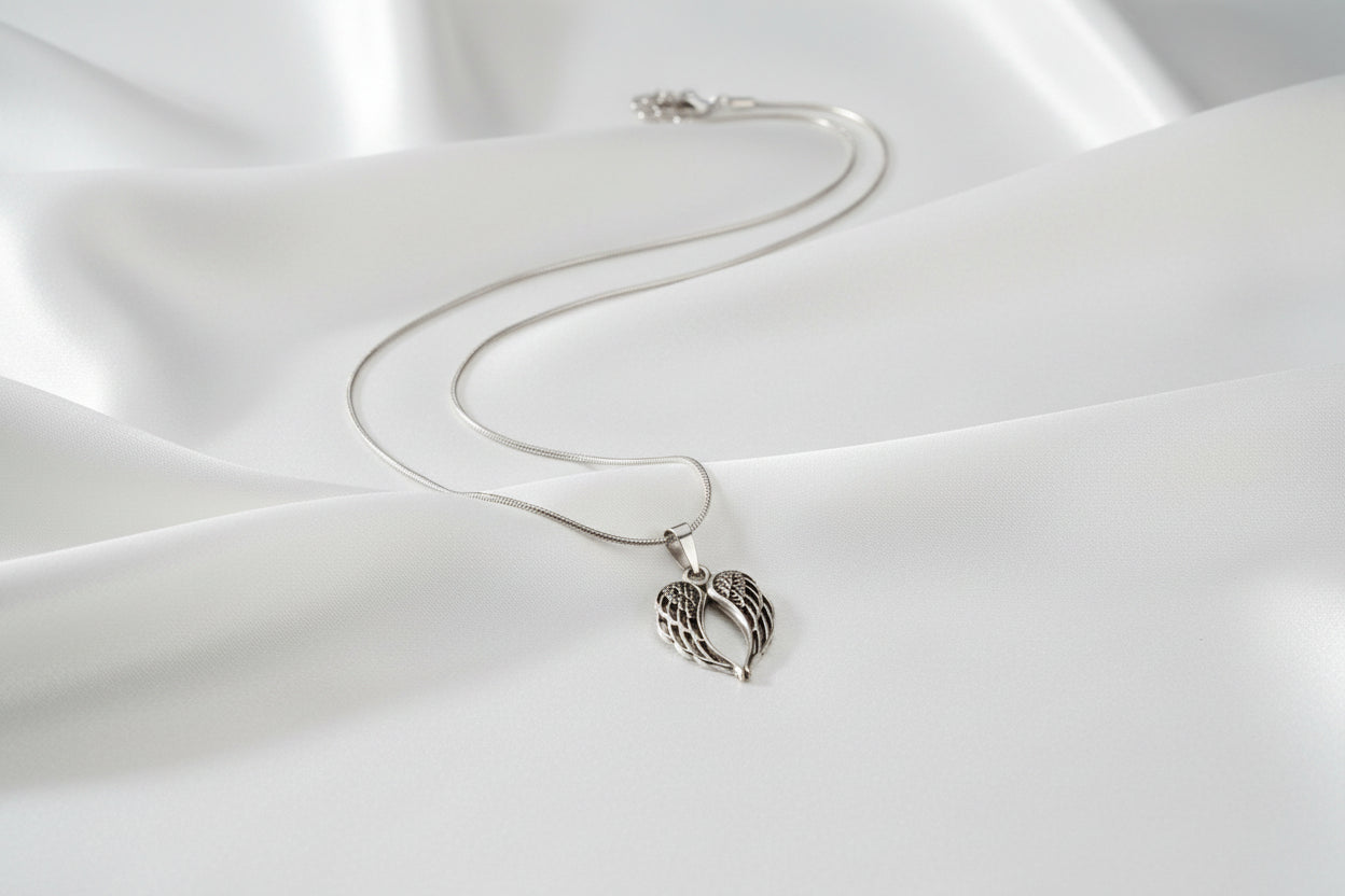 Silver necklace with a unique pendant on a light gray background