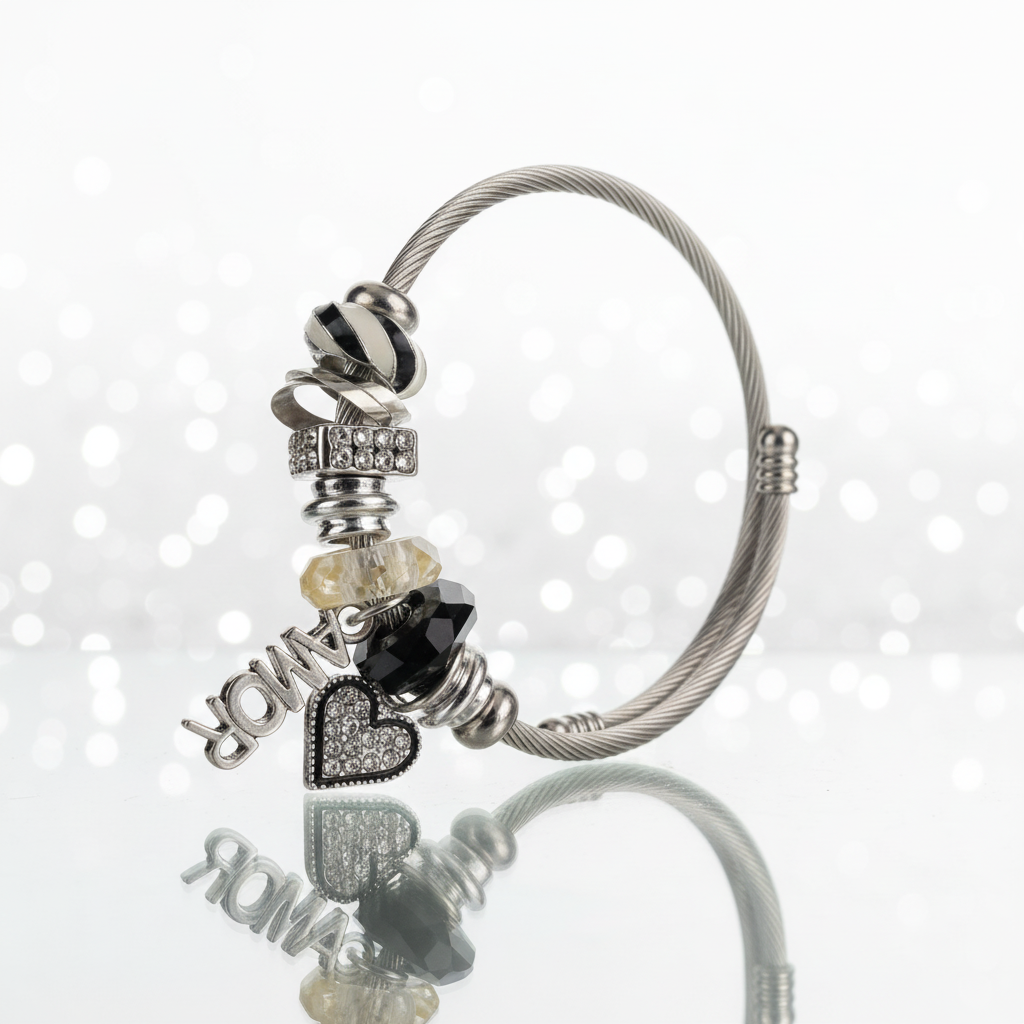 Amor Dark Elegance Cable Bangle on glass surface with mirror reflection